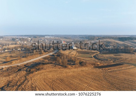 Landscape , field and forest in the distance