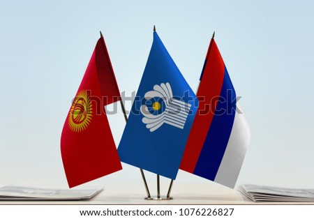 Flags of Kyrgyzstan CIS and Serbian Krajina. Cloth of flags is 3d rendering, the rest is a photo.