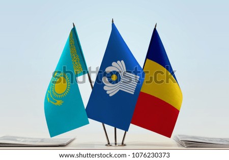 Flags of Kazakhstan CIS and Romania. Cloth of flags is 3d rendering, the rest is a photo.