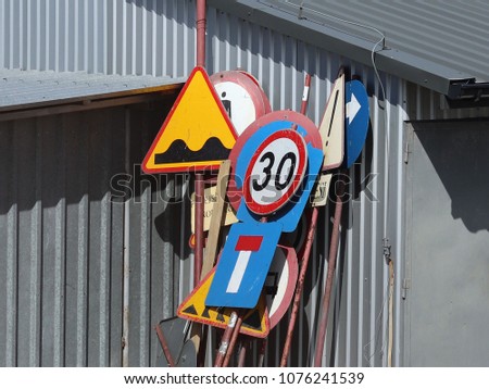 Warehouse of old worn road signs. Rusty metalol. Regulation and rules of the road. Safety of public and personal transport.