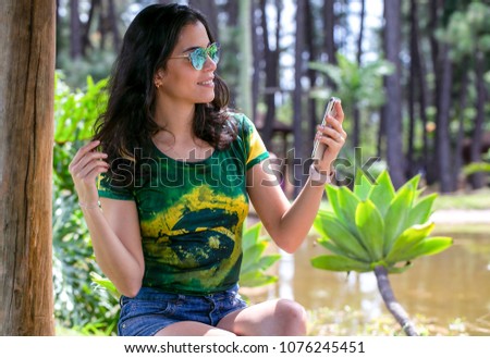 The gorgeous brunette girl posing for a selfie. Time to relax. Summer sun. Healthy life. Modern life. Female beauty. Lifestyle.