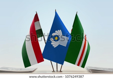 Flags of Hungary CIS and Chechen Republic of Ichkeria. Cloth of flags is 3d rendering, the rest is a photo.