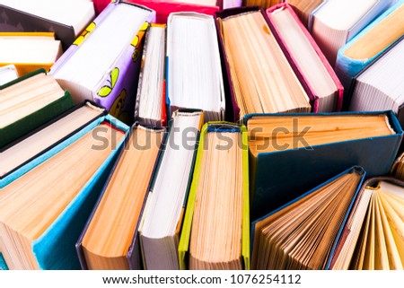 Open book, hardback books on bright colorful background. Back to school. Copy space for text