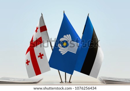 Flags of Georgia CIS and Estonia. Cloth of flags is 3d rendering, the rest is a photo.