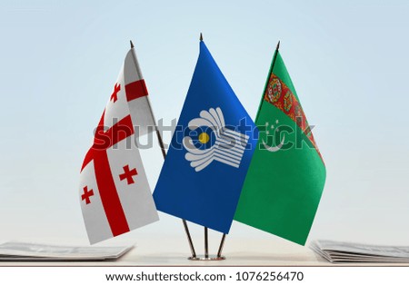 Flags of Georgia CIS and Turkmenistan. Cloth of flags is 3d rendering, the rest is a photo.