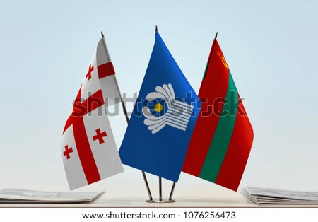 Flags of Georgia CIS and Transnistria. Cloth of flags is 3d rendering, the rest is a photo.