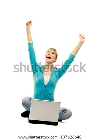 A woman sitting with a laptop is holding hands up, isolated on white