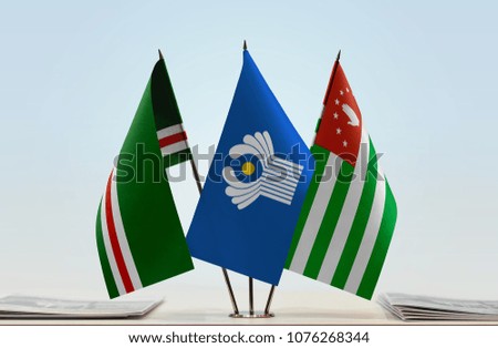 Flags of Chechen Republic of Ichkeria CIS and Abkhazia. Cloth of flags is 3d rendering, the rest is a photo.