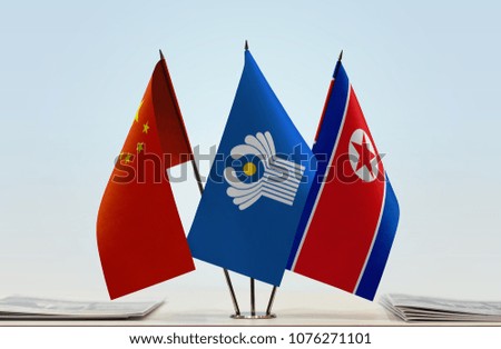Flags of China CIS and North Korea. Cloth of flags is 3d rendering, the rest is a photo.