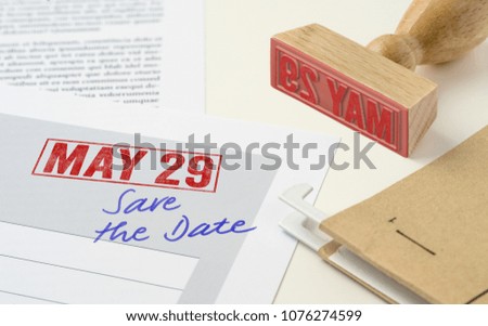 A red stamp on a document - May 29