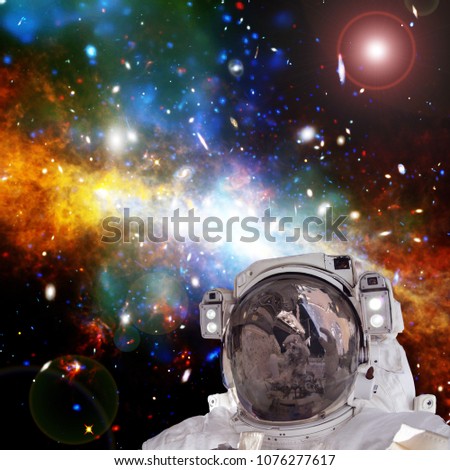 Astronaut and nebula and stars. Science theme. The elements of this image furnished by NASA.