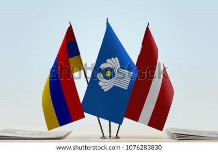 Flags of Armenia CIS and Latvia. Cloth of flags is 3d rendering, the rest is a photo.