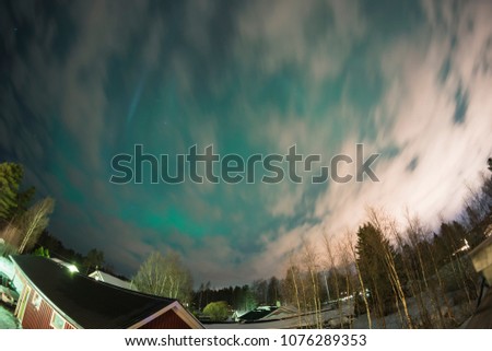 Northern Lights (Aurora borealis) at swedish countryside, north of country, village, fish eye photo