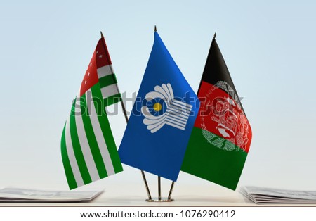 Flags of Abkhazia CIS and Afghanistan. Cloth of flags is 3d rendering, the rest is a photo.