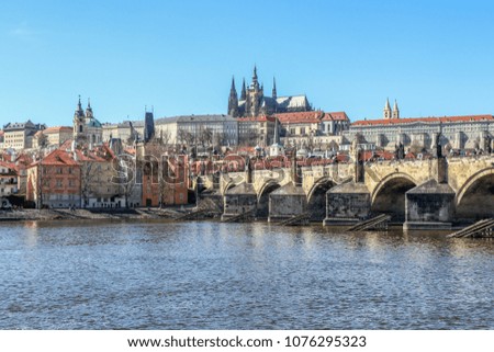 Scenic view of the Prague Castle and Charles Bridge over the Vltava river in the beautiful city of Prague.