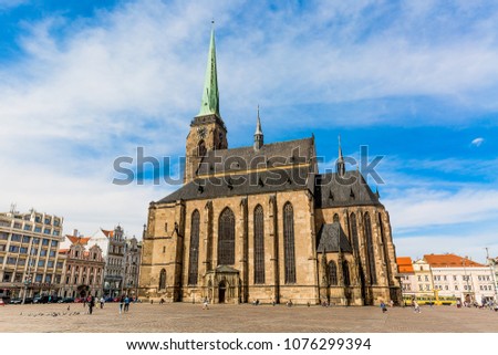 St. Bartholomew's Cathedral in the main square of Plzen with blue sky and clouds in sunny day. Czech Republic, Pilsen. Famous landmark in Czech Republic, Bohemia. Royalty-Free Stock Photo #1076299394