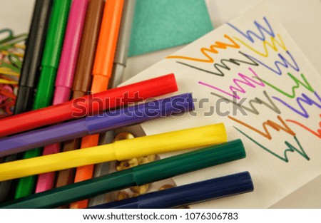 Stationery,  felt-tip pen, pushpins and paper clips on the white background