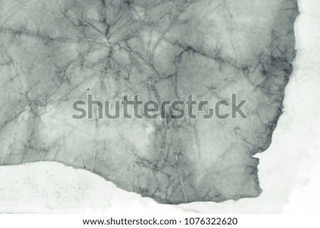 Blank aged paper sheet as old dirty frame background with dust and stains. Front view. Vintage and antique art concept. Detailed closeup studio shot. Black and white toned