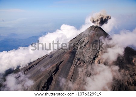 Aerial view of erupting Fuego Volcano in Guatemala. Royalty-Free Stock Photo #1076329919