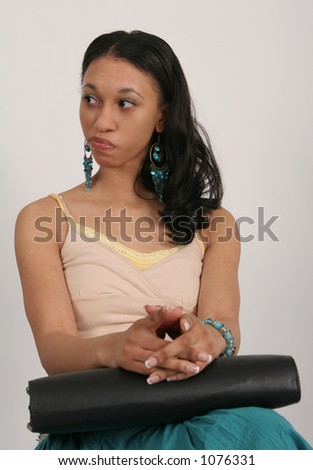 Young African American woman sitting with portfolio in her lap