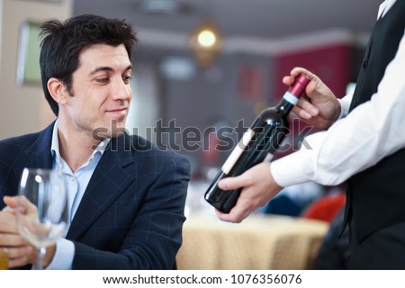 Man choosing wine in a restaurant