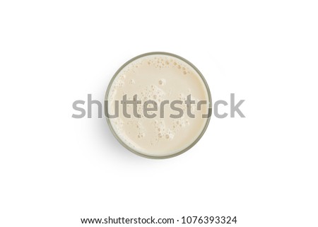 Cup with soy milk bubble foam on top view texture background object design