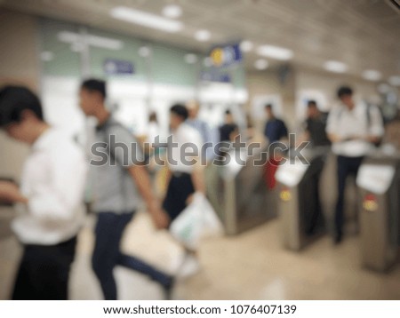 blurred image of business people, passenger or city human lifestyle pass from electronic gates at subway station or metro card station, transport in rush hour. transportation concept