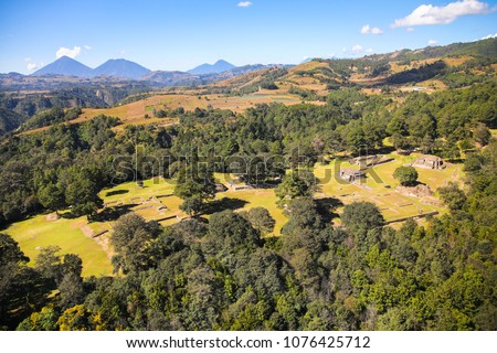 Aerial view of the archaeoligical site of Iximché located in Chimaltenango, Guatemala. It was the capital of the Late Postclassic Kaqchikel Maya kingdom from 1470 until its abandonment in 1524. Royalty-Free Stock Photo #1076425712
