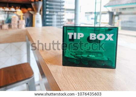  green tip box  at  coffee shop.