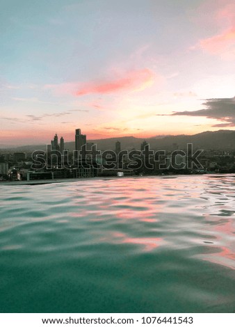 Sunset City View from Rooftop Infinity Pool