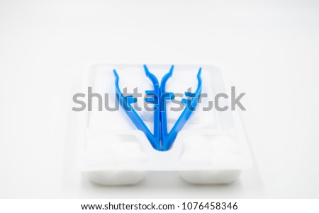 Medical nursing set contains of tweezers, gauze pieces with white tray isolated, Handle plastic clip, cotton and wound dressing,Set of dressing, simple plastic set on white background,