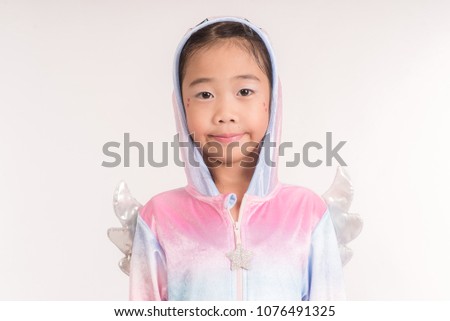 Sweet little kids in unicorn costumes smiling Isolated on a white background