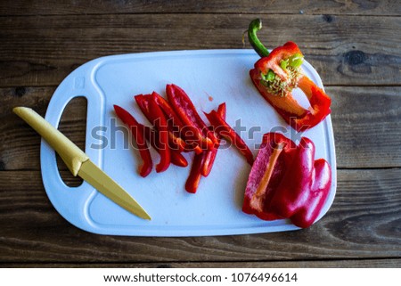 a chopped pepper on the tip with knife
