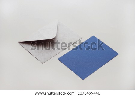 Envelope with blue postcard 