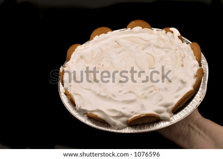 lemon pie on black background hand held