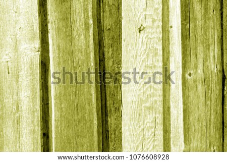 Old wooden fence pattern in yellow color. Abstract background and texture for design.