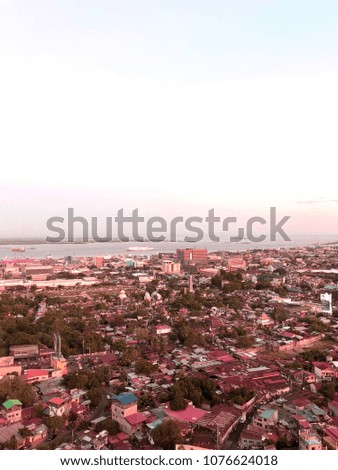 Sunset View of City Buildings from Rooftop