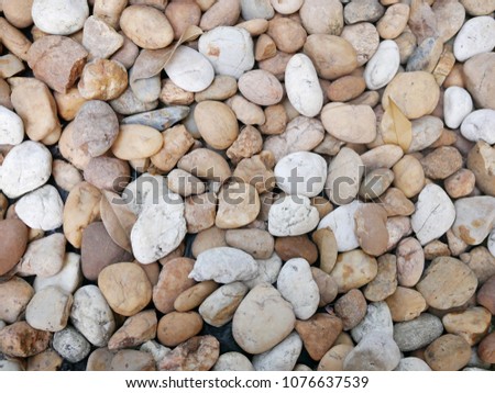 white and orange rocks for background, gravel