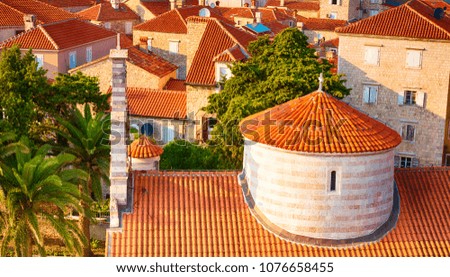 Beautiful panoramic cityscape of old town of Budva with red tiled roofs, Montenegro. Horizontal Wallpaper