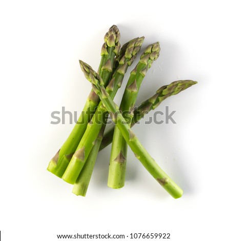 Bunch of Raw Garden Asparagus with Shadow Isolated. Fresh Green Spring Vegetables on White Background. Edible Sprouts of Asparagus Officinalis Top View Royalty-Free Stock Photo #1076659922
