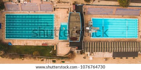 Aerial top view of two swimming pools