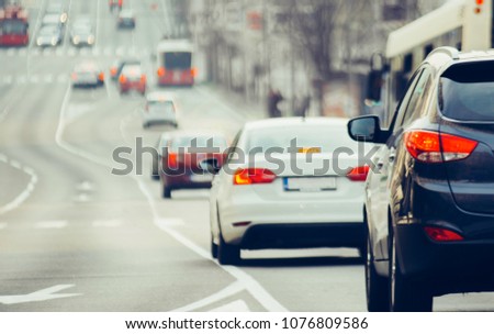 Traffic jam on urban street in city Royalty-Free Stock Photo #1076809586