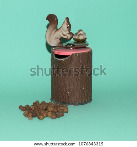Vintage spice mill in the form of a squirrel sitting on a stump.