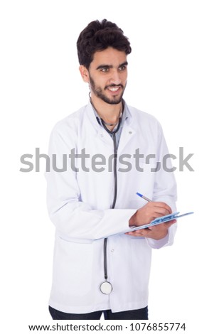 Handsome doctor wearing his coat and stethoscope holding a pen and a paper, writing a description, isolated on white background