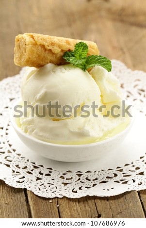 creamy vanilla ice cream in a white cup