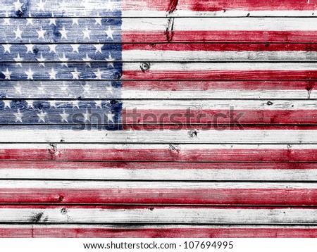 The USA flag painted on wooden fence