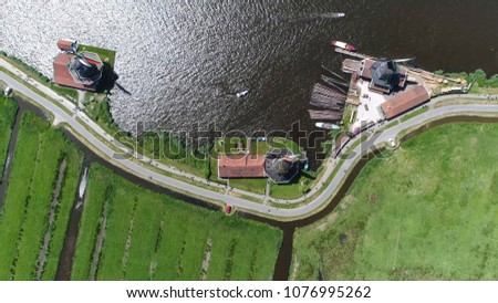 Aerial top down picture of windmills of Zaanse Schans one of most popular tourist attractions of the Netherlands and an anchor point of ERIH the European Route of Industrial Heritage