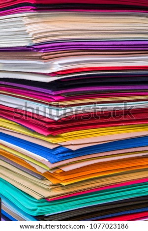 Abstract background, a stack of colored layers of felt