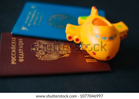 Russian and Kazakhstan passport. Yellow Plane