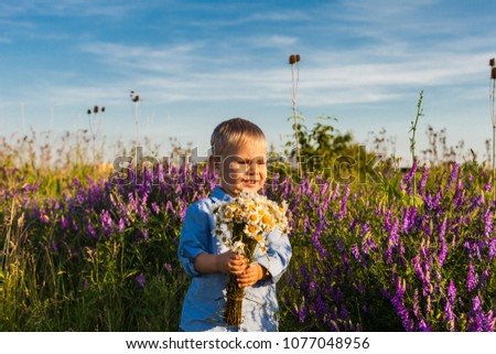 Cute boy with flowers